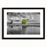 Framed wall art featuring a serene marsh landscape design in a black frame with a mat, highlighting vibrant greens and earthy tones, perfect for home decor.