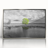 Framed acrylic wall art showcasing a serene marsh landscape with vibrant greens and blues, highlighted by a sleek silver frame, ideal for home decor.