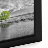 Close-up view of a framed canvas wall art featuring a vibrant landscape of a marsh and swamp, showcasing rich greens and blues that evoke tranquility and nature's beauty. Ideal for home decor, this artwork brings an organic touch to any space.