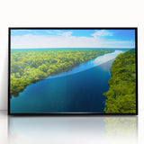 Framed acrylic wall art featuring a serene landscape of a marsh and swamp, with lush greenery and tranquil water, presented in a sleek black frame, perfect for home decor.