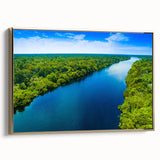 Framed canvas wall art depicting a vibrant swamp landscape with lush greenery and tranquil water reflections, featuring a gold frame that enhances its elegance.