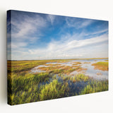 Stretched canvas wall art showcasing a serene marsh landscape with vibrant greens and calming blues, ideal for nature-themed decor in home interiors.