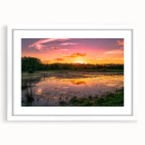 Framed wall art featuring a serene marsh landscape design with lush greenery and tranquil water reflections, presented in a white mat and frame, perfect for home decor.