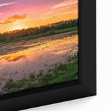 Close-up of a framed canvas artwork depicting a serene marsh landscape with lush greenery and subtle water reflections, ideal for nature-inspired home decor. This piece enhances tranquility and natural beauty in any space.
