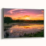 Framed canvas wall art depicting a serene marsh landscape with vibrant greens and blues, featuring intricate details and a sleek silver frame, perfect for home decor.