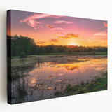 Stretched canvas artwork depicting a tranquil marsh landscape with lush greenery and reflective water under a serene sky, perfect for nature-themed decor.