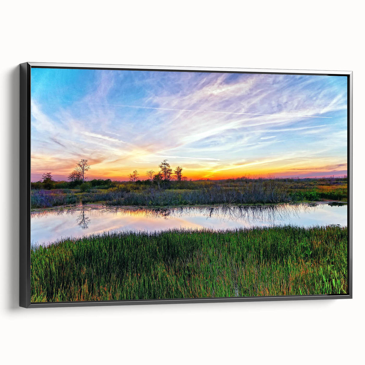 Framed canvas wall art showcasing a serene marsh landscape with vibrant greenery and a tranquil waterway, designed to enhance home decor with nature-inspired aesthetics.