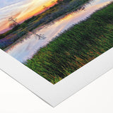 Vibrant rolled canvas art depicting a serene marsh landscape, showcasing lush greenery and tranquil water reflections, perfect for enhancing home decor.