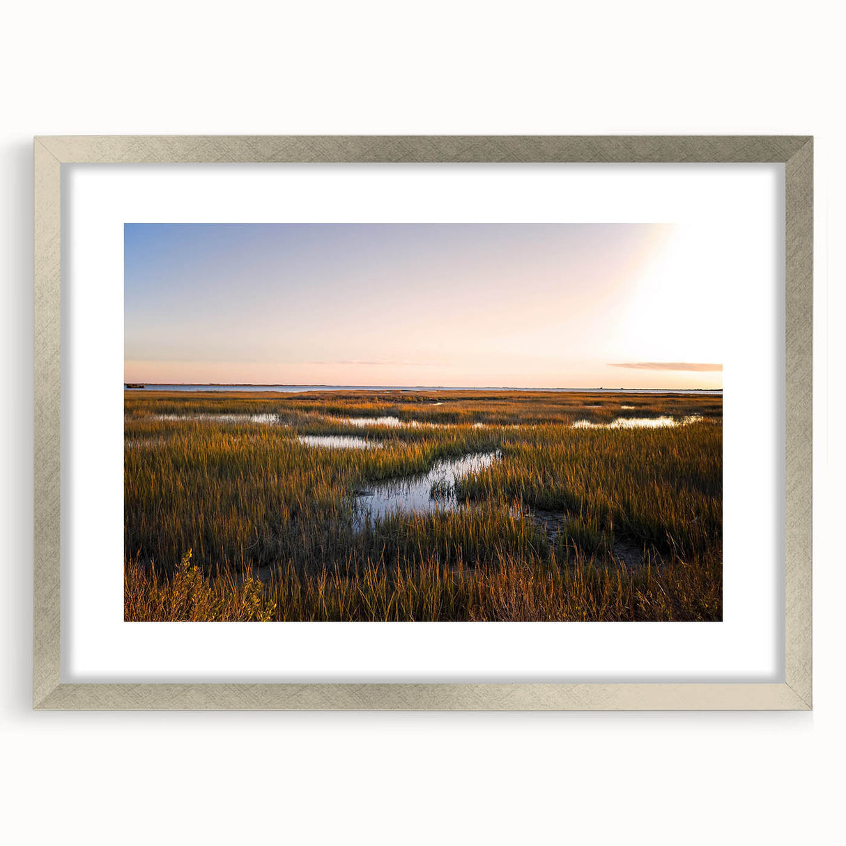 Framed wall art collection showcasing a serene marsh landscape with lush greenery and water reflections, featuring a silver mat and frame for an elegant look.