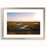 Framed wall art collection showcasing a serene marsh landscape with lush greenery and water reflections, featuring a silver mat and frame for an elegant look.