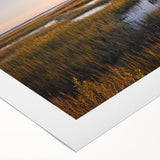 Vibrant rolled canvas artwork depicting a serene marsh landscape with lush greenery and reflective water, ideal for nature-themed decor and wall art collections.