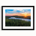 Framed wall art featuring a vibrant marsh and swamp landscape design, showcasing lush greenery and tranquil water, set in a sleek black frame with a mat for added elegance.