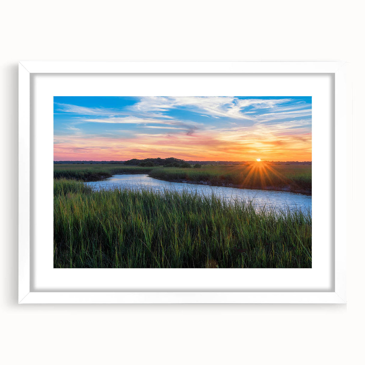 Framed wall art showcasing a serene marsh landscape, featuring lush greenery and tranquil water reflections, presented in a modern white frame.
