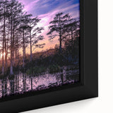 Close-up of a framed canvas wall art piece depicting a serene marsh landscape, featuring lush green foliage and tranquil water reflections, ideal for nature lovers.