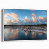 Framed canvas wall art showcasing a serene marsh landscape with vibrant green foliage and soft, reflective water in a stylish white frame, ideal for home decor.