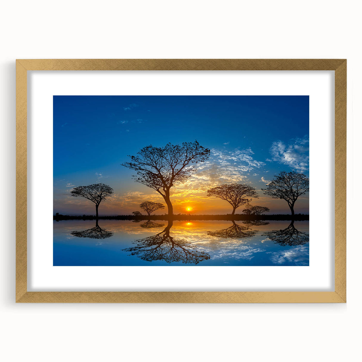 Framed wall art showcasing a serene marsh landscape with lush greenery and a tranquil water body, enhanced by a gold mat and frame, perfect for home decor.