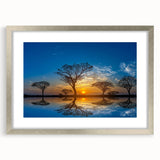 Framed wall art showcasing a serene marsh landscape design with vibrant green foliage and reflective water, presented in a sleek silver frame with matting. Perfect for enhancing any living space.