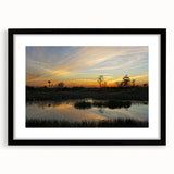 Framed wall art collection featuring a serene marsh landscape with lush greenery and reflective water, set in a sleek black frame with a white mat, perfect for enhancing home decor.