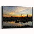 Framed canvas wall art showcasing a serene marsh landscape with vivid greens and blues, set in a sleek black frame, perfect for home decor enhancement.