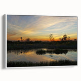 Framed canvas wall art depicting a serene marsh landscape with lush green foliage and a tranquil swamp setting, ideal for nature-inspired decor.