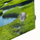 Close-up view of a vibrant acrylic glass wall art piece showcasing a serene marsh landscape with lush greenery and tranquil water reflections, perfect for nature enthusiasts.