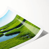 Beautiful landscape print of a serene marsh scene showcasing vibrant green foliage, reflective water, and soft natural lighting, perfect for home decor.