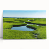 Stretched canvas wall art showcasing a serene marsh landscape with vibrant greenery and soft blues, perfect for nature-inspired home decor. Ideal for adding tranquility and style to any space.