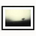 Framed wall art featuring a serene landscape design with mist and fog, presented in a sleek black frame, ideal for modern home decor. The artwork evokes tranquility and emotion, enhancing any living space with its calming aesthetic.