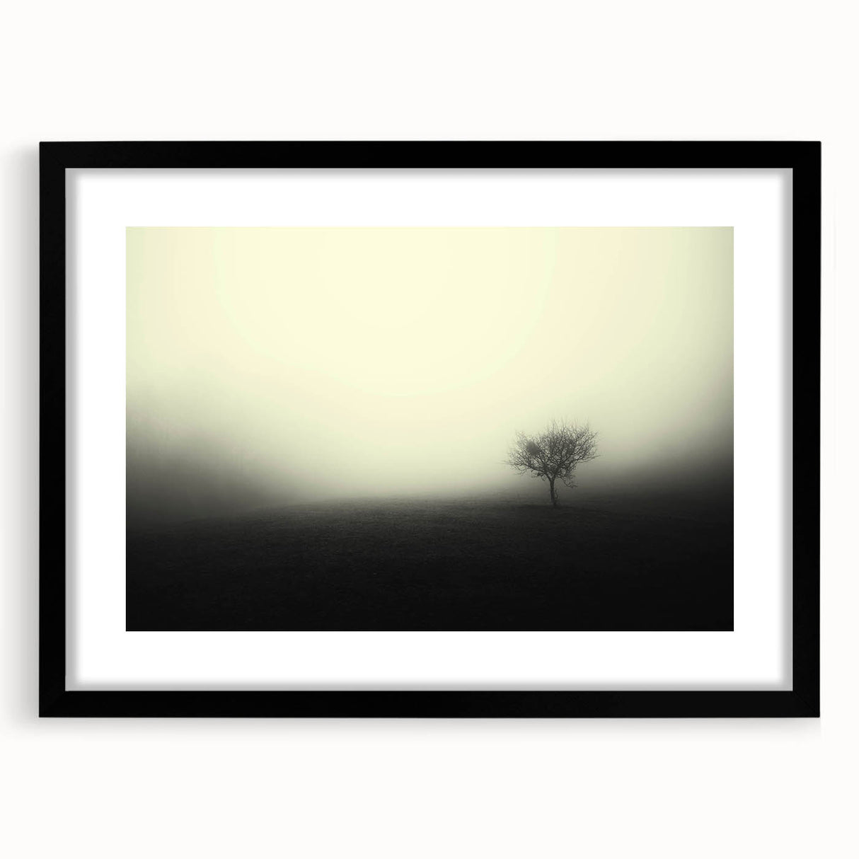 Framed wall art featuring a serene landscape design with mist and fog, presented in a sleek black frame, ideal for modern home decor. The artwork evokes tranquility and emotion, enhancing any living space with its calming aesthetic.
