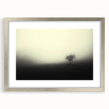 Framed misty landscape wall art with a silver mat, showcasing serene foggy scenery, perfect for living room decor, adding a calming touch to any space.