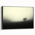 Framed canvas wall art showcasing a serene misty landscape design, featuring soft hues of blue and gray, presented in a sleek black frame, perfect for home decor.
