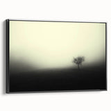 Framed canvas wall art showcasing a serene misty landscape design, featuring soft hues of blue and gray, presented in a sleek black frame, perfect for home decor.
