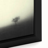 Framed canvas art showcasing a serene landscape scene with misty fog, featuring soft blue and gray hues, perfect for modern home décor and tranquility.