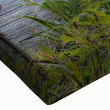 Close-up of a stretched canvas wall art piece depicting a serene landscape shrouded in mist, showcasing soft hues of gray and blue, perfect for home decor.