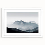 Framed wall art showcasing a serene landscape design with mist and fog, featuring a white mat and sleek frame, ideal for enhancing modern home decor.