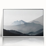 Framed acrylic wall art showcasing a misty landscape design in soft, muted colors, perfect for adding a serene touch to modern home decor. The piece features a sleek white frame, enhancing its elegance and making it an ideal focal point for any room.