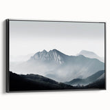 Framed canvas wall art showcasing a serene misty landscape design, featuring soft gray and blue tones, elegantly displayed in a sleek black frame, perfect for home decor.