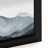 Framed canvas wall art featuring a serene misty landscape design in soft hues of gray and blue, perfect for enhancing home decor with a tranquil vibe.