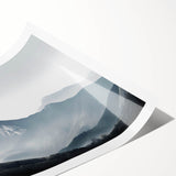 Mist-covered landscape wall art print showcasing ethereal mountains and serene valleys in soft hues of blue and gray, perfect for home decor.