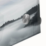 Close-up view of a vibrant acrylic glass wall art piece featuring a misty landscape design, showcasing soft hues of blue and gray, perfect for modern home decor.