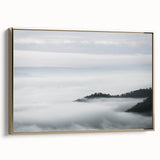 Framed canvas wall art showcasing a misty landscape design with foggy hues, accented by a gold frame; perfect for enhancing home decor with a serene ambiance.