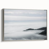 Framed canvas wall art featuring a serene landscape design with mist and fog, showcasing soft gray and silver tones, perfect for home decor enhancement.