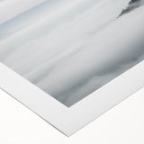 Rolled canvas artwork depicting a serene misty landscape with fog, showcasing soft hues of blue and gray, ideal for enhancing home decor aesthetics.