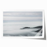 Serene landscape wall art print featuring ethereal mist and fog enveloping a forest scene, designed for home decor with calming, natural aesthetics.