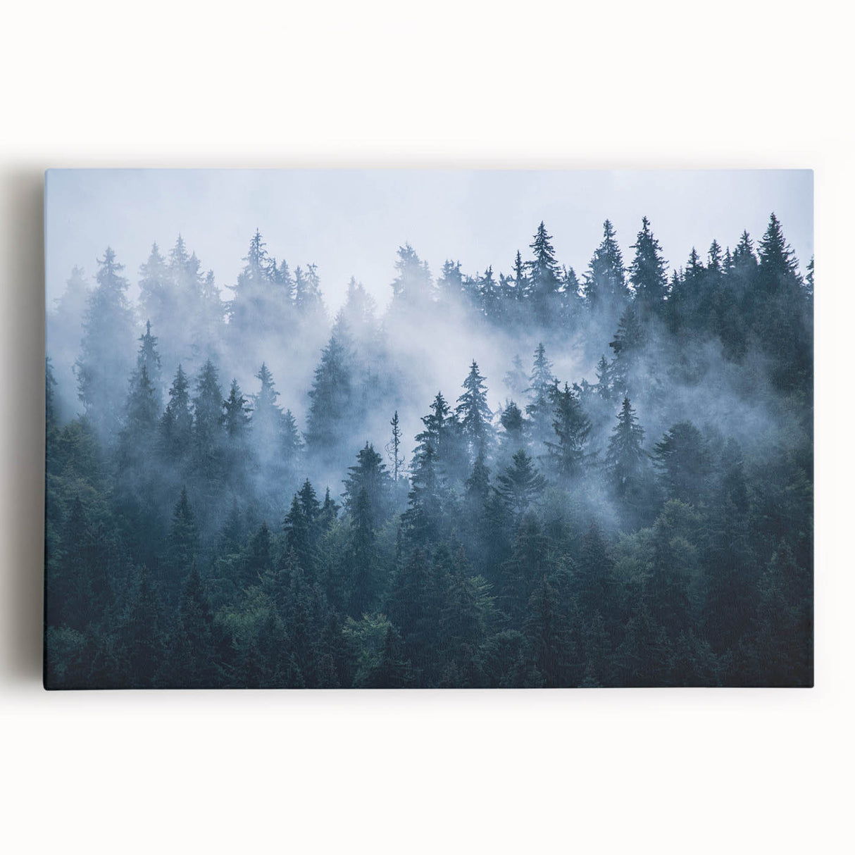Stretched canvas wall art featuring a serene misty landscape design, showcasing soft hues of blue and gray, perfect for enhancing tranquil home decor.