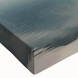 Close-up of a stretched canvas wall art piece depicting serene misty landscapes with soft, muted colors, perfect for enhancing any modern home decor.