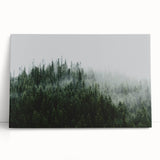Stretched canvas wall art featuring a serene misty landscape with soft fog enveloping trees, perfect for enhancing home decor with calming nature vibes.