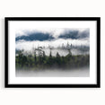Framed wall art featuring a misty landscape design, showcasing soft gray and blue hues, perfect for adding tranquility to home decor. Black frame with mat included.