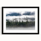 Framed wall art featuring a misty landscape design, showcasing soft gray and blue hues, perfect for adding tranquility to home decor. Black frame with mat included.