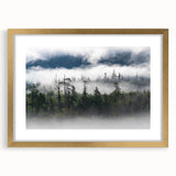 Framed wall art featuring a serene misty landscape design in soft pastel colors, complemented by a gold frame and white matting, perfect for home decor.